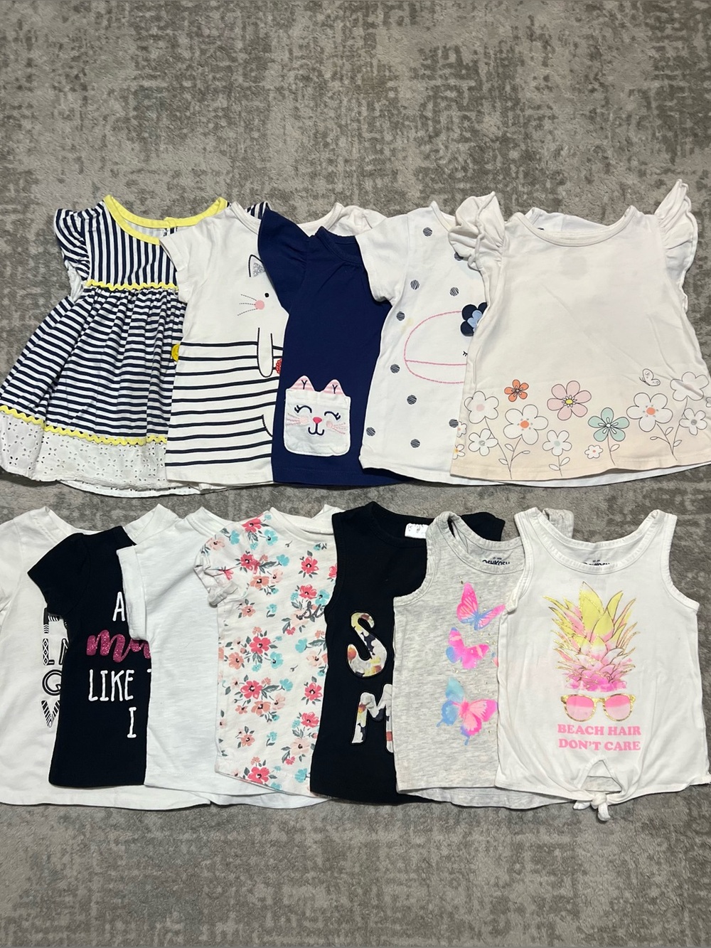 12 baby girl short sleeve shirts. Size 12m-18m